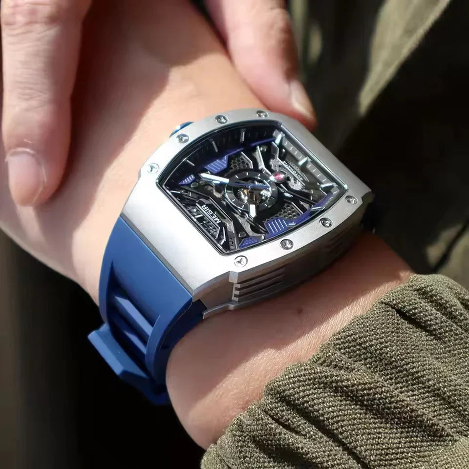 Motorsport-inspired luxury watch with skeleton dial and blue rubber strap on wrist