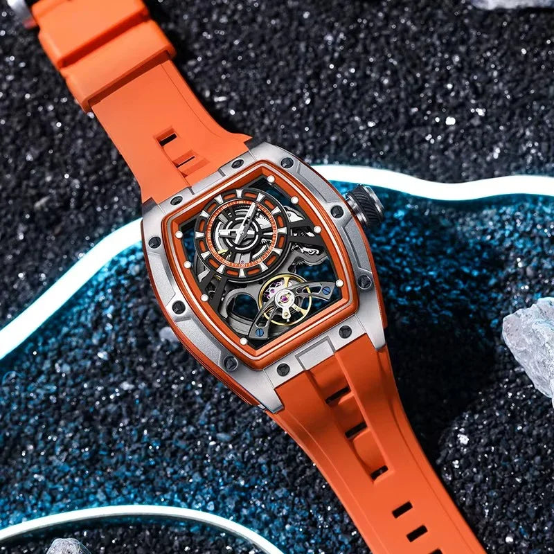 Luxury racing-inspired skeleton watch with orange strap and tonneau case on textured background