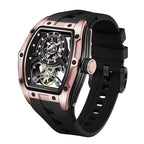 Luxury sport-inspired watch with rose gold-toned tonneau case, skeleton dial, and black rubber strap