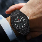 Luxury carbon fiber sport watch with black marble-effect case and date display on wrist