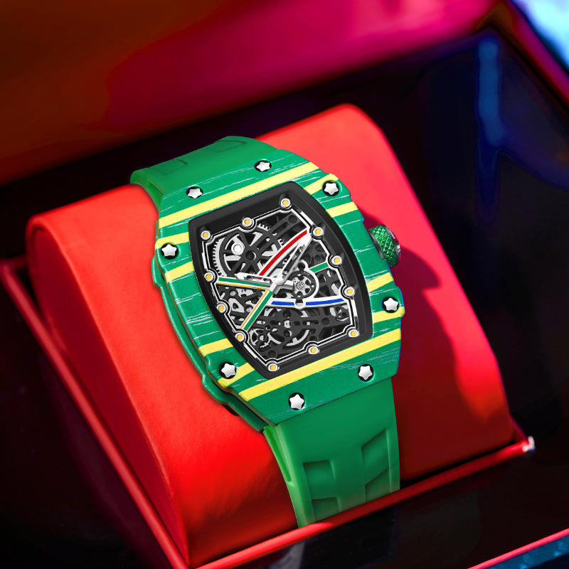 Green and yellow racing-inspired luxury watch with skeleton dial, displayed in red box