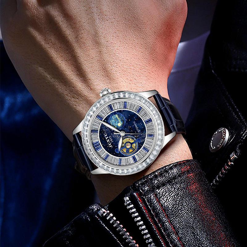 Luxury racing-inspired watch with blue starry dial, gemstone bezel, and leather strap on wrist
