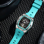 Sport-luxury skeleton watch with turquoise strap and tonneau case, motorsport-inspired design