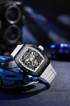 Motorsport-inspired skeleton automatic watch with tonneau case and white strap, sporty car backdrop