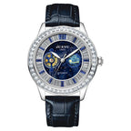 Luxury automatic sport watch with blue celestial dial, crystal bezel, and black leather strap