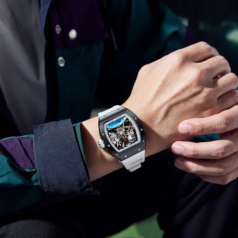 Motorsport-inspired skeleton dial watch with white strap and bold luxury design on wrist