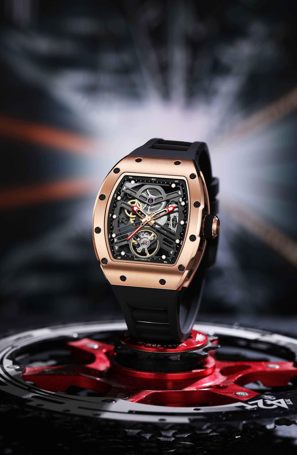 Motorsport-inspired luxury watch with tonneau case, skeleton dial, and black rubber strap