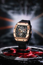 Motorsport-inspired luxury watch with tonneau case, skeleton dial, and black rubber strap