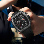 Bold black chronograph watch with carbon fiber case, motorsport-inspired design, and sport-luxury style for everyday wear.