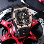 Motorsport-inspired luxury watch with skeleton dial, rose gold-tone case, and black rubber strap