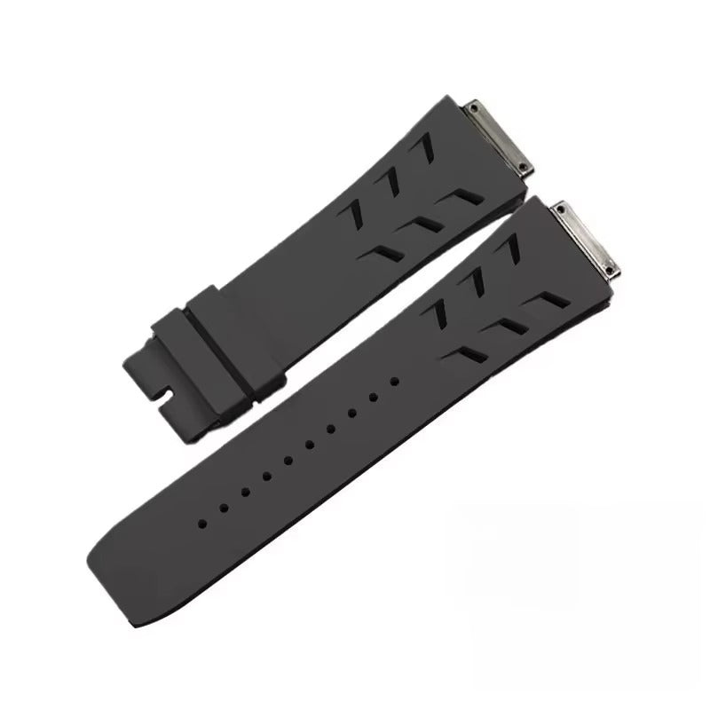 Black rubber watch strap with sporty perforations and quick-release pins for luxury chronograph timepieces